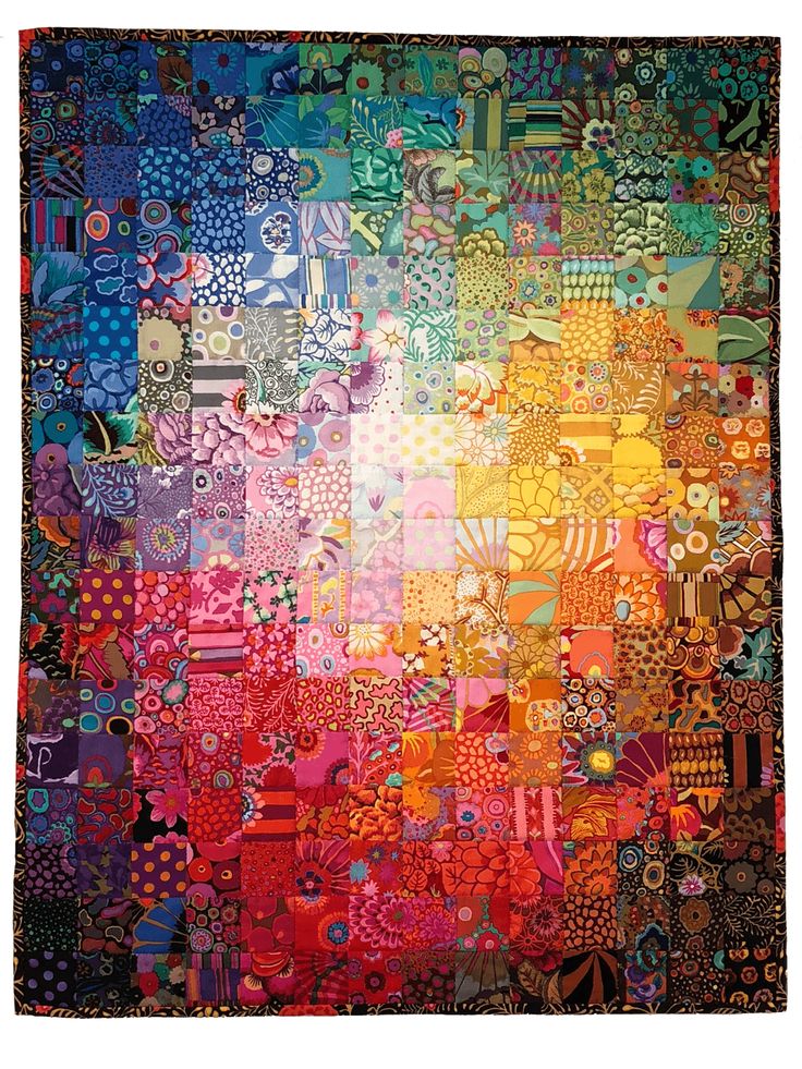 a multicolored quilt with many different designs on it