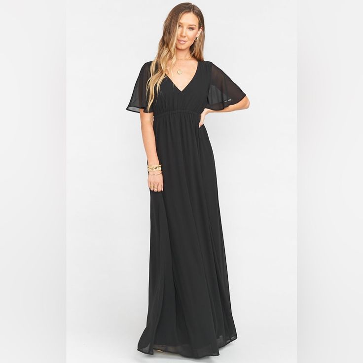 The Emily Empire Maxi Is An Elegant Silhouette With A Flirty Sleeve And An Elastic Empire Band Just Below The Bust To Compliment All Shapes And Sizes As Well As A Baby Bump! 100% Polyester Dry Clean Or Hand Wash Cold Lay Flat To Dry Love Your Mu She Loves You. Made In The Usa Flowy V-neck Maxi Dress For Cocktail, Flowy V-neck Maxi Evening Dress, Flowy V-neck Evening Maxi Dress, Flowy V-neck Maxi Dress For Evening, Flowy Short Sleeve Maxi Dress For Evening, Flowy Maxi Dress With Short Sleeves For Evening, Black Chiffon V-neck Dress, Black Short Sleeve Evening Maxi Dress, Elegant Black Maxi Dress With Short Sleeves