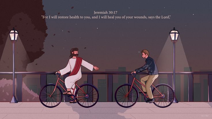 two people riding bikes on a bridge at night