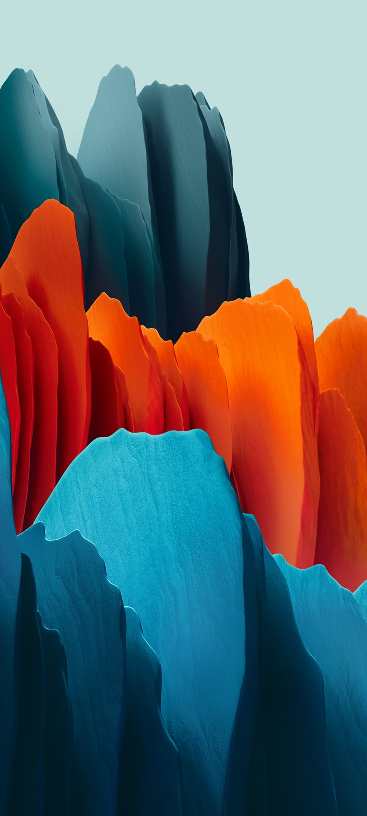 an abstract photograph of blue, orange and black rocks with mountains in the back ground