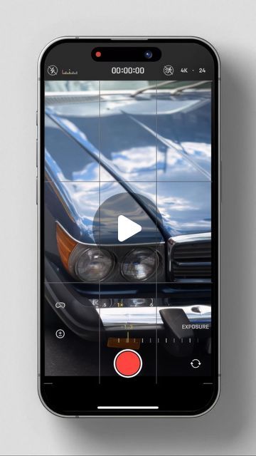 a cell phone with an image of a car on the screen