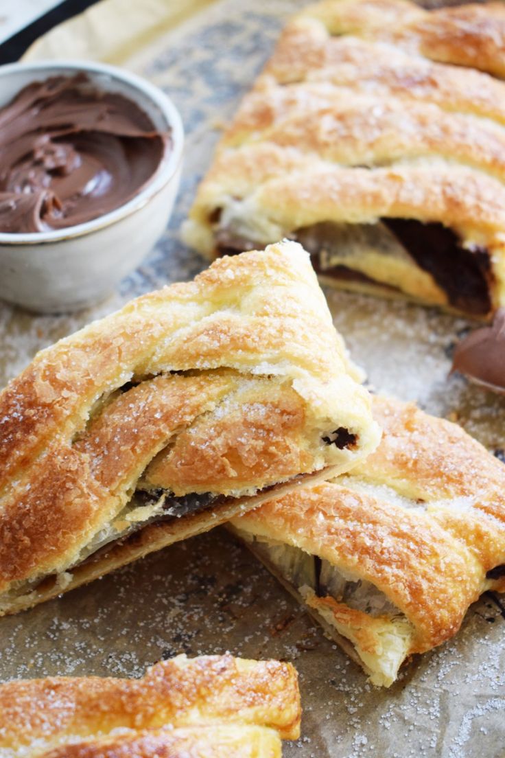 nutella puff pastry braids with chocolate spread on top and in the background,