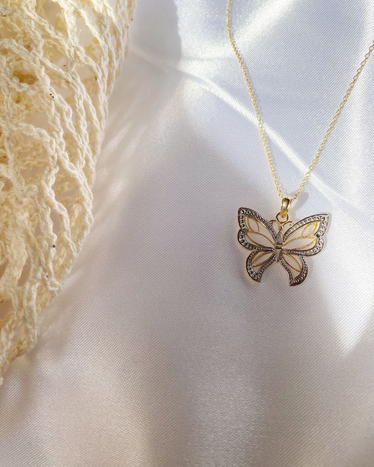 Give her the gift of wings with this beautiful butterfly necklace. DETAILS - 14k yellow gold butterfly with rhodium plating - Chain option is a 14k yellow gold cable chain - Chain style may vary slightly - Approximately 3/4 inch wide x 3/4 inch tall (including bail) VARIATIONS If you require any variation of this style (a different style chain, longer chain, etc.) feel free to message us. We will do our best to accommodate you. Additional costs may apply depending on the variation. POLICY We do Elegant Butterfly Jewelry As A Gift For Her, Elegant Butterfly Jewelry Gift For Her, White Butterfly Necklace In Fine Jewelry Style, Luxury Sterling Silver Butterfly Necklace As A Gift, Formal White Necklace With Butterfly Charm, Luxury Gold Butterfly Jewelry, Luxury Yellow Gold Butterfly Necklace, Luxury Gold Butterfly Charm Necklace, Luxury Gold Necklace With Butterfly Charm