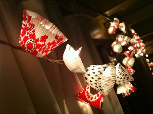 red and white paper fan lights hanging from the ceiling