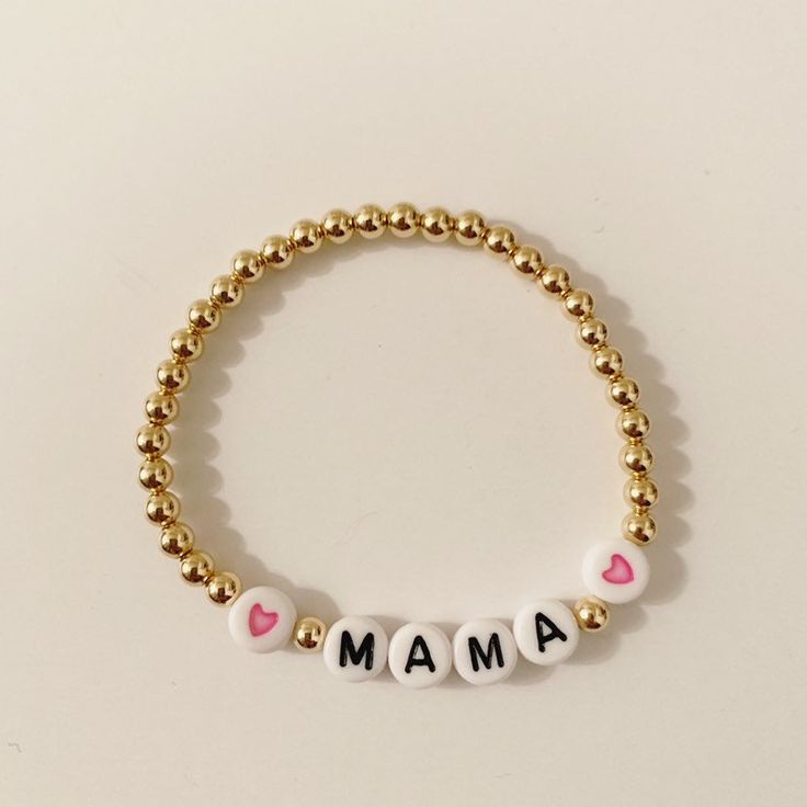 This is the perfect gift for a new mom, your best friend or yourself! This listing is for one custom made 14k gold filled 4mm custom beaded Mama bracelet. If you choose this listing, it will include the pink hearts, blue heart, red hearts or black hearts Beads are 14k gold filled so they should not tarnish or peel. Please allow 2 weeks for this item to ship. To measure wrist size, I suggest you measure the actual size of your wrist and add 1/2 inch so it fits comfortably. If you need the size ad Custom Name Adjustable 14k Gold Jewelry, Personalized Gold Beaded Bracelets, Personalized Gift Gold Beaded Round Bracelets, Personalized Gold Beaded Bracelet, Personalized Gold Round Beaded Bracelets, Minimalist Personalized Jewelry With Round Beads, Handmade 14k Gold-filled Beaded Bracelets As Gift, Customized Everyday Rose Gold Jewelry, Gold Hypoallergenic Name Bracelet With Round Beads