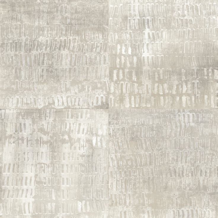 a white and gray rug with different patterns on the surface, including lines in shades of grey