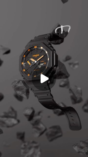 a watch is flying through the air with rocks in the background