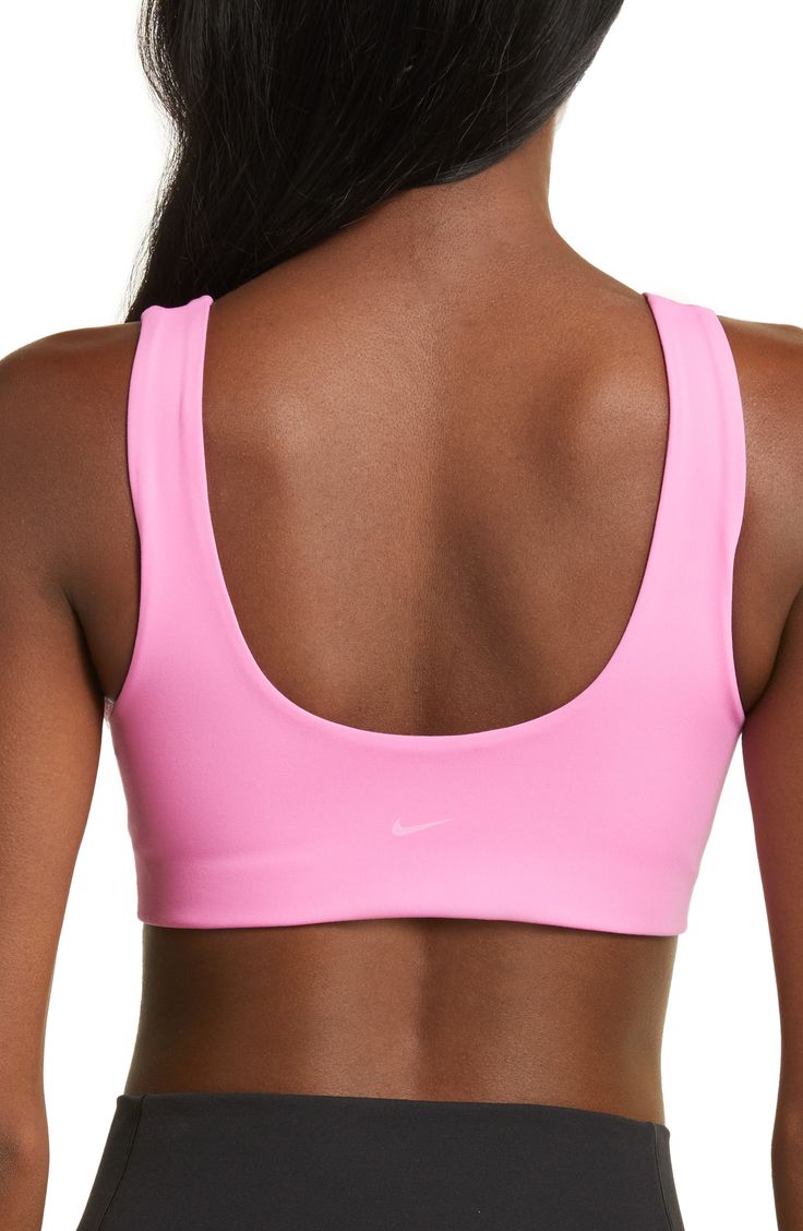 Get into the zone on and off the pickleball court wearing this stretchy, minimalist sports bra with a tonal logo on the back. Elasticized straps Lined 80% polyester, 20% spandex Machine wash, line dry Imported Sports Bra With Padded Back, Sports Stretch Bra With Padded Back, Fitted Sports Bra With Padded Back, Stretch Sports Bra With Padded Back For Gym, Nike Sports Bra With Moisture-wicking Medium Support, Nike Moisture-wicking Sports Bra For Gym, Nike Medium Support Moisture-wicking Sports Bra, Padded Back Stretch Sports Bra, Sporty Yoga Activewear With Padded Back