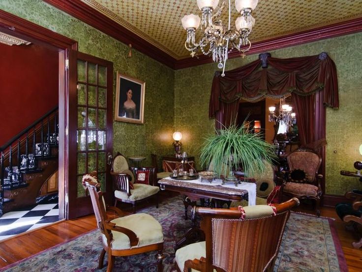 a living room filled with furniture and a chandelier