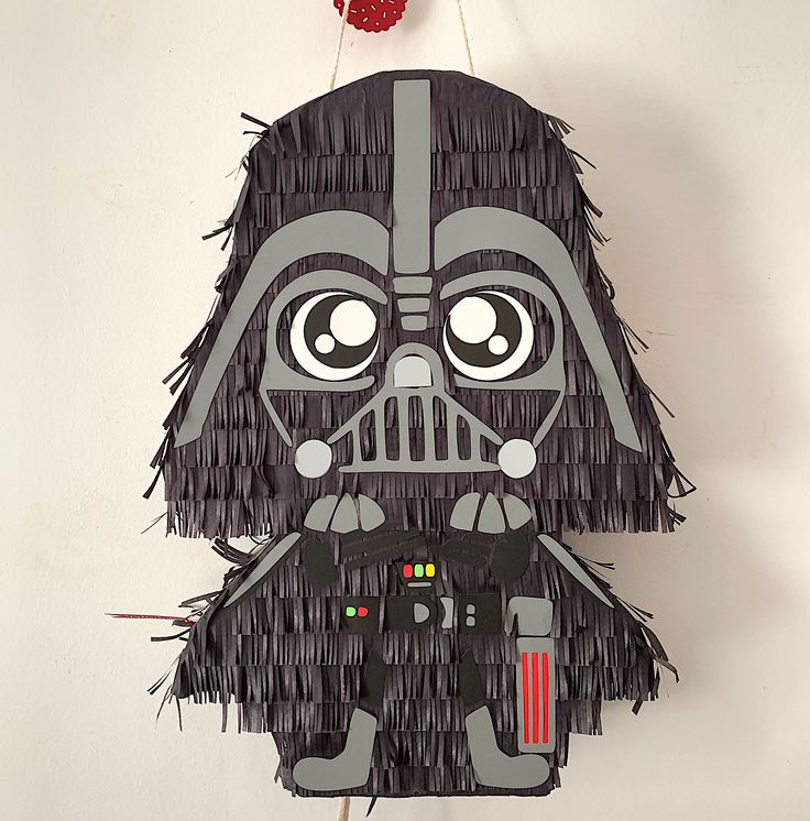 a darth vader pinata hanging on a wall