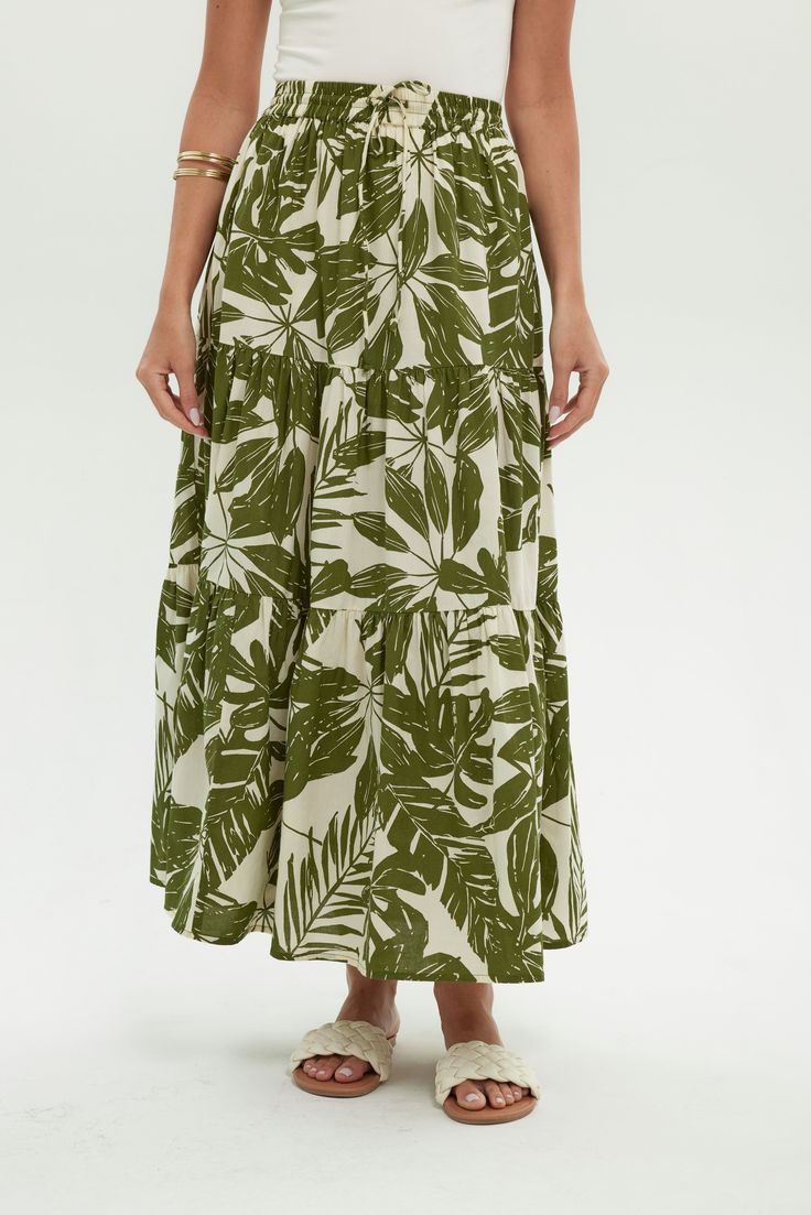 Grove Leaf Vacation Bottoms With Lined Voluminous Skirt, Casual Voluminous Maxi Skirt For Vacation, Casual Voluminous Skirt For The Beach, Voluminous Lined Skirt For Vacation, Green Tiered Maxi Skirt For Day Out, Casual Tiered Maxi Skirt For Vacation, Beach Tiered Flowy Skirt, Green Tiered Skirt For Vacation, Casual Vacation Maxi Skirt With Gathered Detail