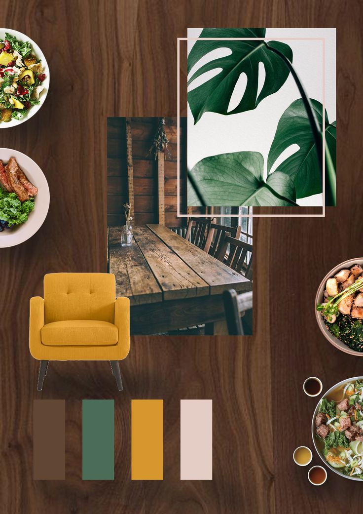 a wooden table topped with plates of food and bowls of salad next to a yellow chair