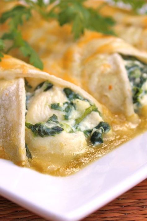 three tortillas with spinach and cheese on a plate