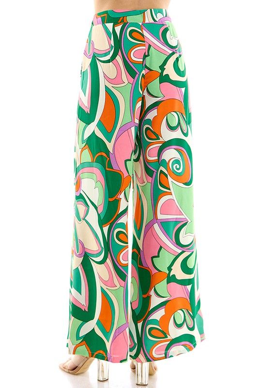 Pucci print, multi color, wide leg, loose fit pant. 100% Polyester Spring Abstract Print Wide Leg Bottoms, Chic Wide Leg Bottoms With Vibrant Print, Chic Wide Leg Bottoms With Bold Print, Summer Wide Leg Bottoms With Abstract Print, Chic Abstract Print Pants For Spring, Wide Leg Bottoms With Abstract Print For Summer, Casual Bottoms With Bold Print For Spring, Summer Multicolor Floral Wide Leg Pants, Vacation Multicolor Printed Wide Leg Pants