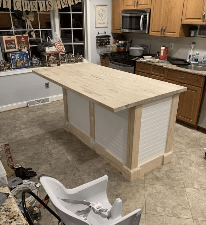 a kitchen island made out of plywood is being worked on