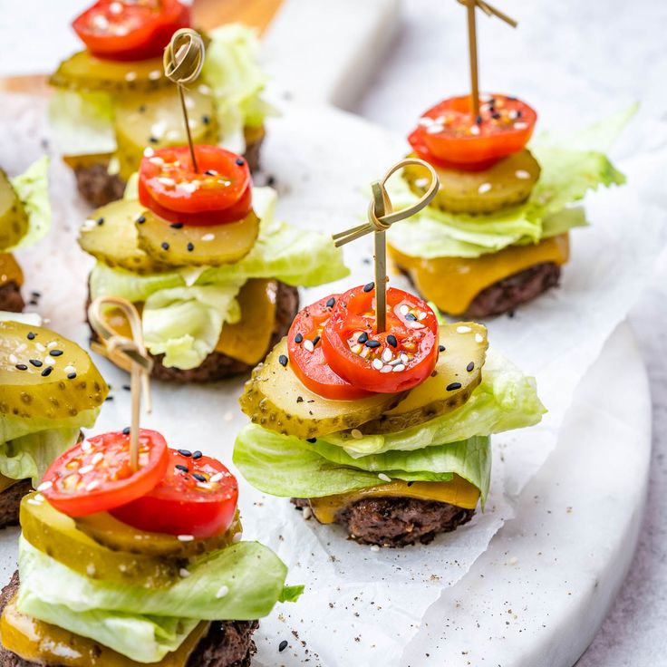 mini burgers with tomatoes, lettuce and pickles on skewers