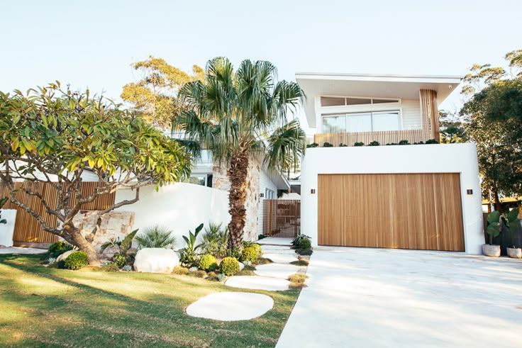 a house with palm trees in front of it