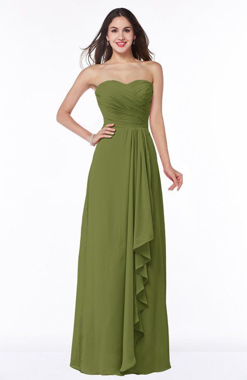 a woman wearing a strapless green bridesmaid dress with ruffles on the skirt