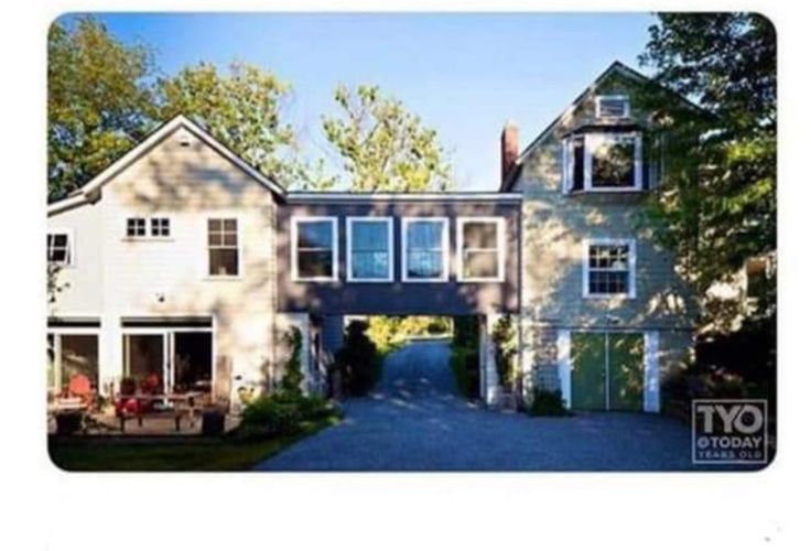 an image of a large house in the woods