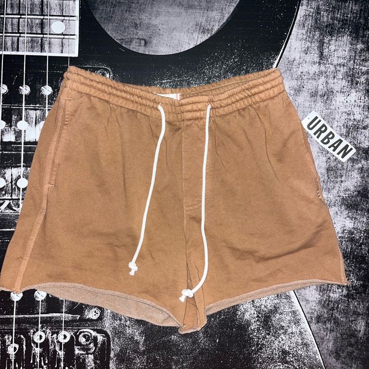 Nwt Bdg Bonfire Cutoff Shorts Color: Blush (Brown) Size: Medium Washed-Soft And Faded Sweatshorts From The Essential Bdg Label. Features A 6" Inseam With Cutoff Hems. Fitted With Pockets And An Adjustable Tie At The Waist. Urban Outfitters Exclusive. Features: - Sweatshorts From Bdg - Cutoff Hems - Adjustable Tie Waist - Uo Exclusive Content + Care: - 80% Cotton, 20% Polyester - Machine Wash Size + Fit: - Model Is 6’0" And Wearing Size Medium - Measurements Taken From Size Medium - Rise: 12" - I Casual Bottoms With Built-in Shorts For Weekend, Casual Brown Cotton Shorts, Brown Relaxed Fit Cotton Shorts, High-waisted Cotton Shorts For The Weekend, Brown Cotton Shorts, Brown Cotton Shorts For Summer, Weekend Bottoms With Pockets In Short Length, Summer Streetwear Shorts With Pockets, Brown High-waisted Cotton Shorts