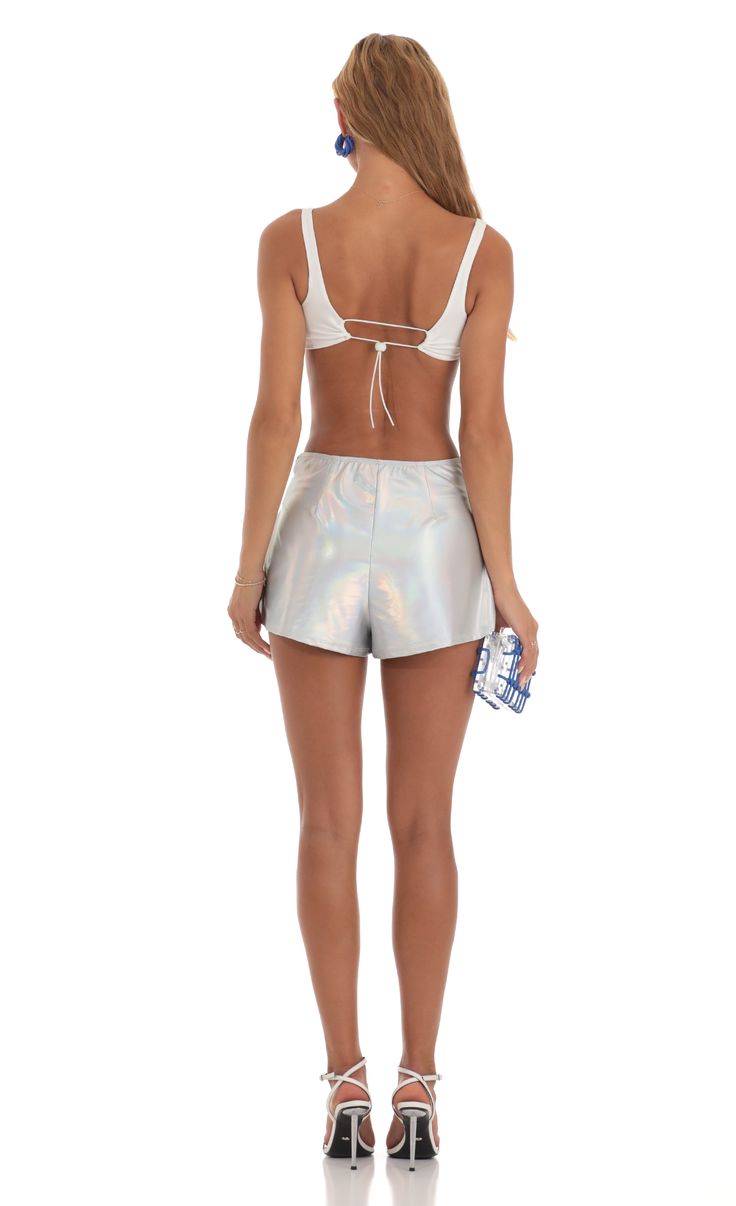 Designed in Los Angeles- Pull-on- Unlined- Made in Iridescent Foil Fabric- Hand wash coldModel is wearing a size small shorts that measures 12in/30cm in lengthSlight modifications might be made to improve garment quality.Handling the garments with care, hand-washing and air-drying is strongly recommended. Iridescent Stretch Bottoms For Summer, Iridescent Bottoms For Summer Party, Metallic Fitted Shorts, Fitted Metallic Shorts, Metallic Bottoms With Built-in Shorts, Metallic Shorts For Summer Party, Fitted Metallic Shorts For Summer, Metallic Party Shorts, Metallic High-waisted Shorts For Summer