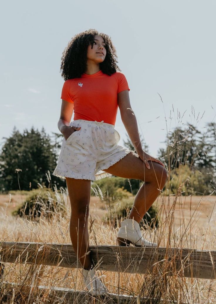 When only the most adorable will do: the Cowboy Dreams Shorts. Tiny blue cowboys dance across this soft cream cotton knit, trimmed with a ruffle hem and finished with a soft elastic waistband. Though inspired by vintage pyjamas, we're sure this style would love to be worn out of the house with the matching cami, or Cactus Clover Tee. Features Roomy pockets Fully elastic waistband Ruffle trim Decorative bow 100% vintage cotton, deadstock sourced Machine wash cold, hang to dry. Size chart - Sized for a relaxed lounge fit. If you are in between sizes, you can size down for a more fitted look. A note from the designer: Storytime. We were originally only going to include the camisole in this collection. But in the eleventh hour (aka - right before our photoshoot) we just couldn't resist whippin Cotton Bottoms With Ruffles For Day Out, Cotton Ruffle Bottoms For Day Out, Short Cotton Bottoms With Ruffles, Cute Summer Bottoms With Ruffle Hem, Casual Cotton Bottoms With Ruffle Hem, Cotton Bottoms With Ruffle Hem For Summer, Casual Bottoms With Ruffle Hem For Day Out, Casual Ruffle Hem Bottoms For Day Out, Casual Ruffle Hem Shorts