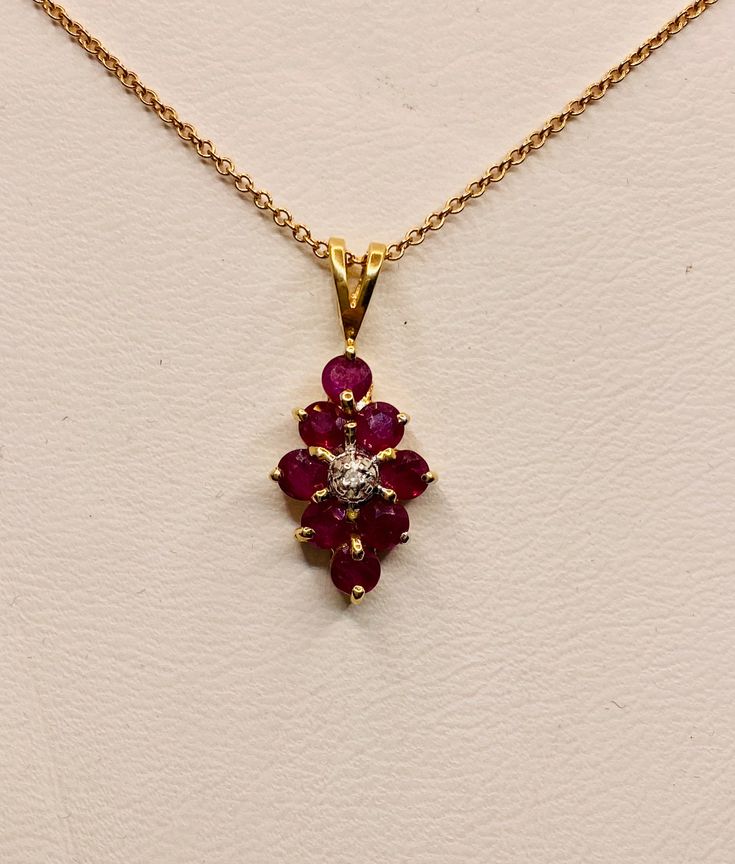 Beautiful Vintage 14k Yellow Gold Natural Rubies Pendant 100% Genuine Ruby Rubies 1.00CT Diamond(s) 0.01CT Color: F Clarity: SI2 Total Pendant Weight: 1.2GR 14K Yellow Gold No Chain Necklaces and chains available upon special request For more information regarding this item feel free to reach me so I can accommodate your needs. Thank you 14k Gold Hallmarked Diamond Necklace For Anniversary, Exquisite 14k Gold Necklace With Prong Setting, 14k Yellow Gold Necklace With Prong Setting, Formal Yellow Gold Necklace With Ruby, Formal Red 14k Gold Necklace, Yellow Gold Ruby Jewelry Stamped 14k, Classic Red Diamond Necklace For Anniversary, Classic 14k Gold Hallmarked Diamond Necklace, Gold Ruby Diamond Necklace For Anniversary