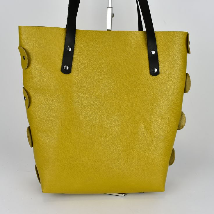 What a gorgeous mustard yellow purse/tote bag! This purse is made with 100% leather and is put together totally with rivets. The black straps are also oil tanned leather. The inside is not lined and that gives this tote that really cool look. Very roomy! The bottom of the purse has metal purse feet. Also, available in a light-colored leather with ostrich print. Size: 13” tall x 13” wide x 5” deep [33cm x 33cm x 13cm] Colors on the screen are as true as possible. Please realize that all monitors Yellow Bags With Leather Handles For On-the-go, Leather Bucket Hobo Bag With Snap Closure, Everyday Leather Satchel With Snap Closure, Leather Satchel With Snap Closure For Daily Use, Double Handle Hobo Bag With Snap Closure For Shopping, Modern Yellow Bucket Bag For Everyday Use, Chic Yellow Bags With Leather Lining, Modern Yellow Bucket Bag For Everyday, Yellow Leather Shoulder Bag For On-the-go