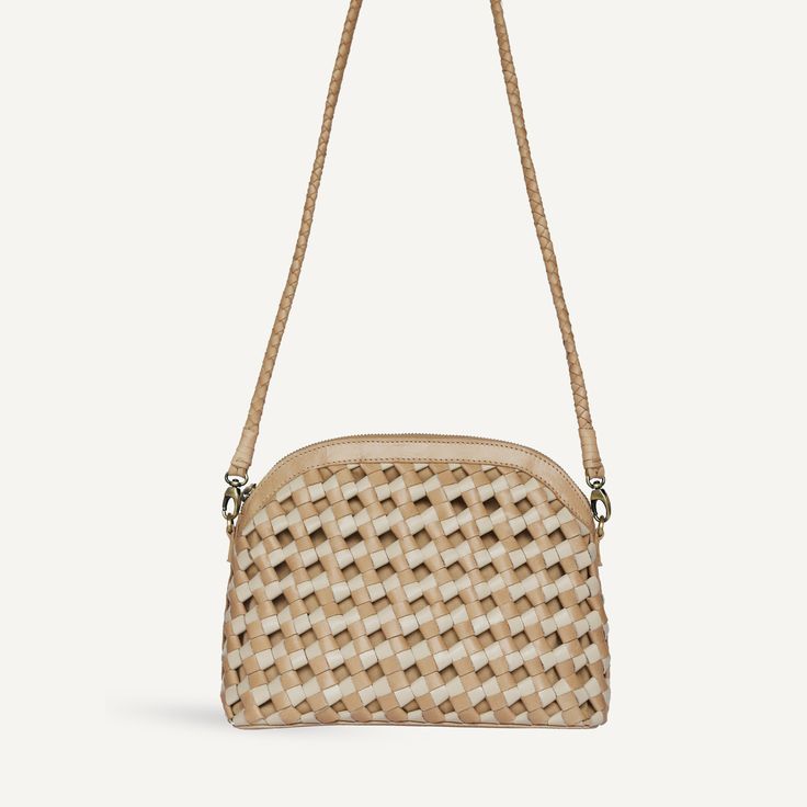 An oh-so-chic day bag (and the one our founder wears daily!). In a buttery soft, knotted woven leather with an arched top shape. Don’t be fooled by the size, Carmen is surprisingly roomy. Wear it long on your shoulder, crossbody, or tie the long strap into a knot and watch it transform into something new. On-the-go Woven Natural Shoulder Bag, Chic Shoulder Bag With Interwoven Design For Travel, Chic Shoulder Bag With Interwoven Design For Everyday, Chic Everyday Shoulder Bag With Interwoven Design, Chic Shoulder Bag With Interwoven Design, Chic Natural Shoulder Bag With Intrecciato Weave, Chic Rectangular Shoulder Bag With Interwoven Design, Natural Woven Leather Shoulder Bag, Versatile Natural Woven Leather Shoulder Bag