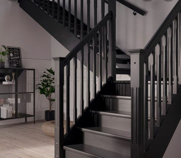 there is a black and white staircase in the house