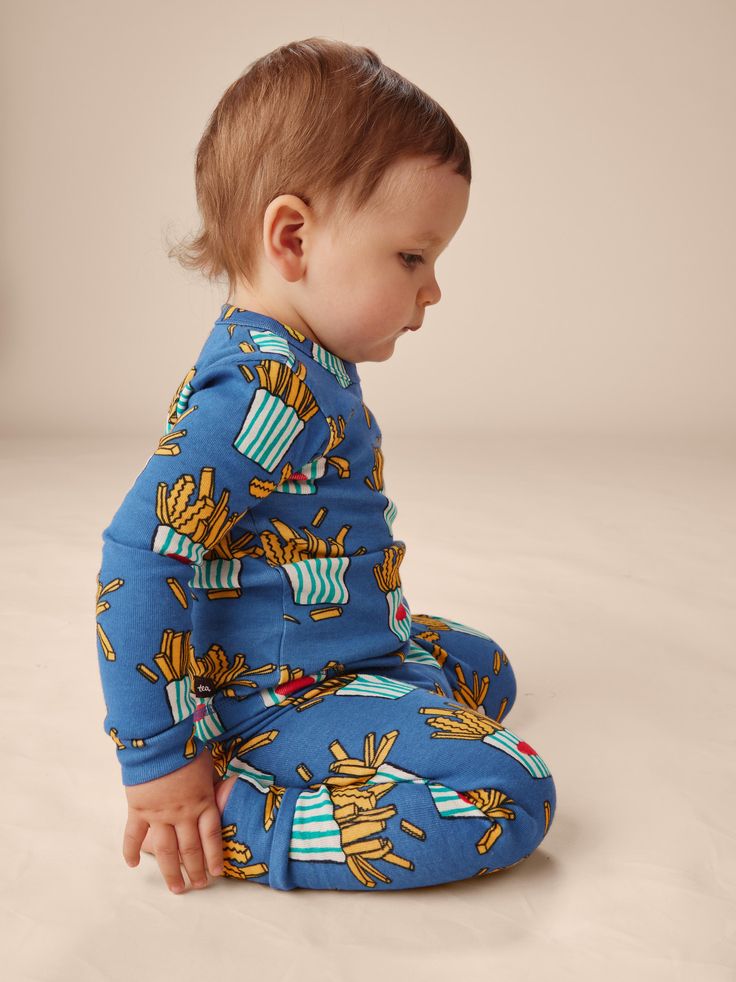 Let's be honest: PJs are what your kiddo lives in most. That's why we put such care into designing the perfect pajama set with dreamy prints and fabric that couldn't be softer. Crafted of 100% cotton rib, our pajamas keep their color and only get cozier wash after wash. Playful Printed Cotton Sleepwear, Playful Printed Sleep Sets, Playful Cartoon Print Sleepwear, Playful Relaxed Fit Sleepwear, Playful Cartoon Print Onesie For Sleep, Playful Cotton Onesie For Sleep, Playful Cartoon Print Onesie For Sleepovers, Playful Printed Blue Sleepwear, Playful Blue Printed Sleepwear