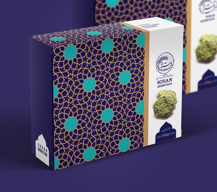 two boxes with broccoli on them sitting side by side in front of a purple background