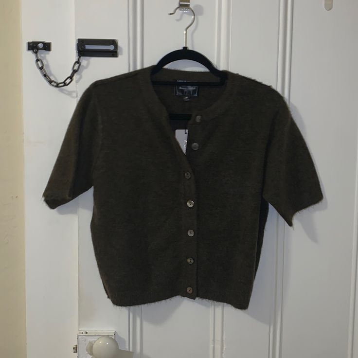 Shirt Sleeve Button Up Sweater. Never Worn. Dark Brown Color Casual Short Sleeve Cardigan With Button Closure, Fall Short Sleeve Tops With Snap Buttons, Short Sleeve Cardigan With Button Closure For Fall, Casual Short Sleeve Cardigan With Buttons, Winter Short Sleeve Tops With Buttons, Winter Tops With Buttons And Short Sleeves, Fitted Short Sleeve Cardigan With Buttons, Cheetah Cardigan, Leopard Cardigan