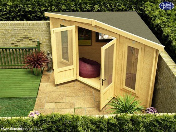 an overhead view of a garden shed with its doors open and a bed in the corner