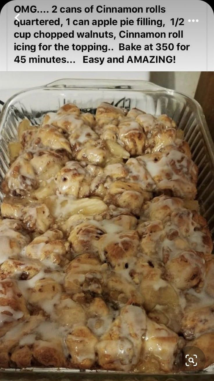 a pan filled with cinnamon rolls covered in icing