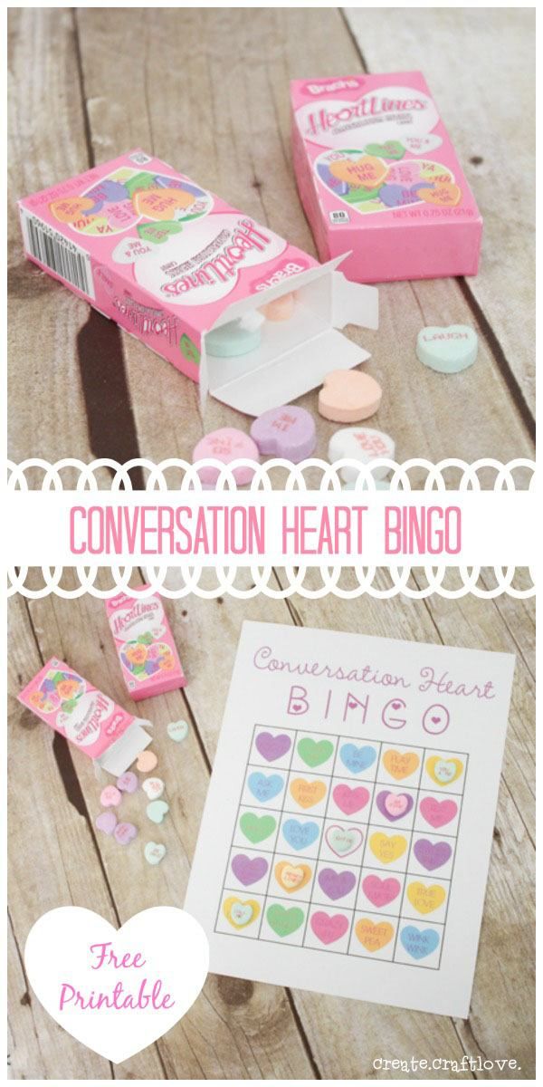 conversation heart bingo game on a wooden table with hearts and candies in the background