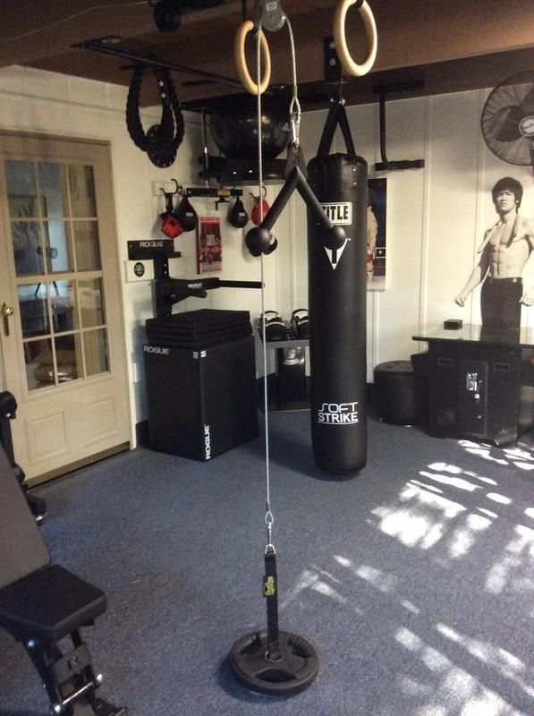 a home gym with punching bag and exercise equipment