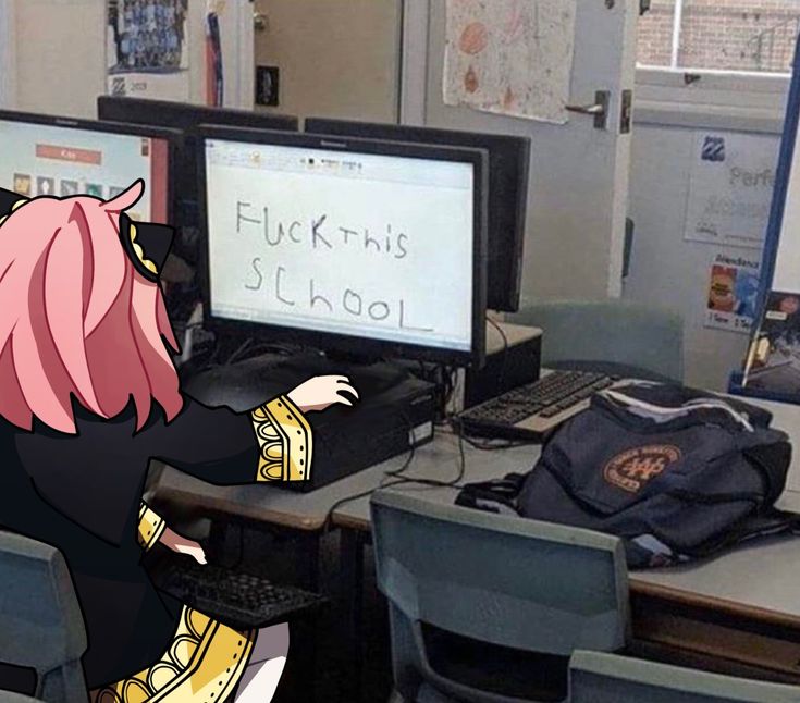 a girl with pink hair standing in front of two computer monitors