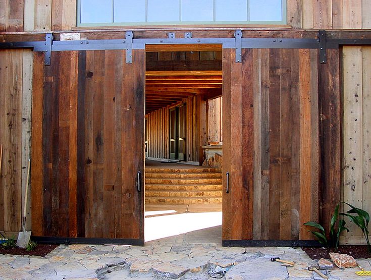 an open wooden door leading into a building