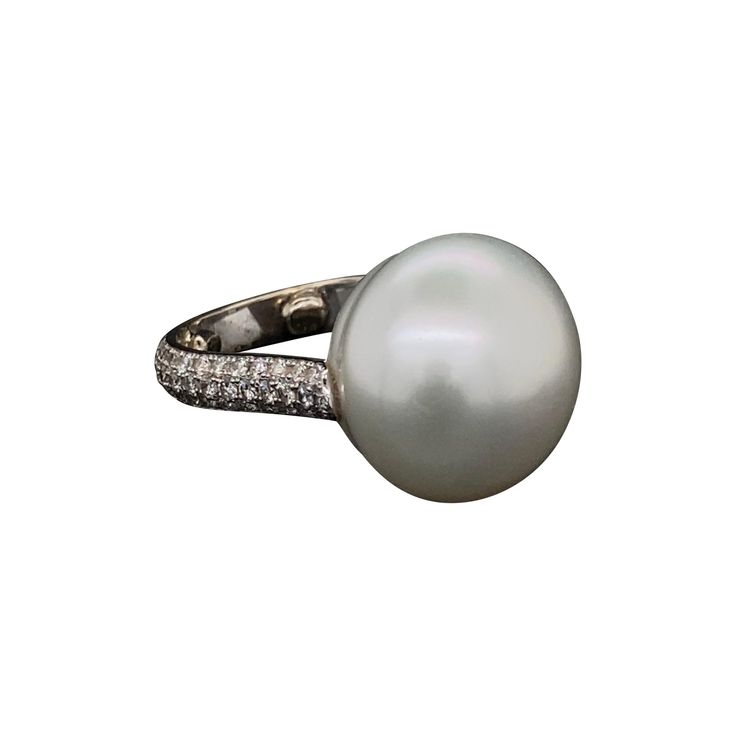 Simply Beautiful! South Sea Pearl and Diamond 18K Gold Ring. Center securely Hand set with a 15.5mm South Sea Button Pearl ring with 74 round brilliant cut Diamonds approx. 0.80tcw set in 3 rows on either side of the shank. Hand crafted 18K white Gold mounting. Ring size 5.5, we offer ring re-sizing. Approx. size: 0.78” w x 0.61” h. Stylish and Timeless...A sure to be admired piece you'll turn to time and again! Mabe Pearl, Sea Pearl, 18k Gold Ring, South Sea Pearls, Sea Pearls, Pearl Diamond, Gold Diamond Rings, Silver Pearls, Round Brilliant Cut Diamond