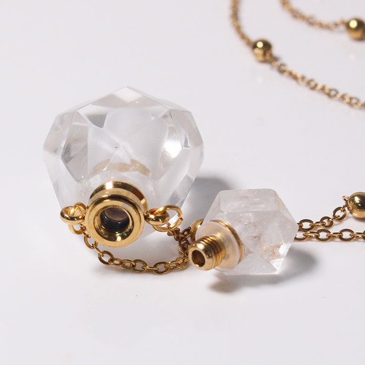 PLEASE NOTE: Our crystal stones are natural minerals and each crystal is unique. The internal ice cracks, pits, mineral points, and color differences of natural crystals are all formed naturally and are normal phenomena, which will not affect the efficacy, beauty and value of the crystal at all.This cute perfume bottle necklace is functional with a screw-off top that allows you to put a small amount of your favorite essential oil or perfume inside. This cutie would make a super special gift for Faceted Clear Crystal Necklaces As Gifts, Faceted Clear Crystal Necklace For Gift, Clear Faceted Crystal Necklace Gift, Clear Faceted Crystal Necklace For Gift, Faceted Quartz Necklaces As Gifts, Faceted Quartz Necklace Gift, Faceted Quartz Necklace For Gift, Quartz Faceted Necklace For Gift, Crystal Necklaces With Natural Stones For Healing