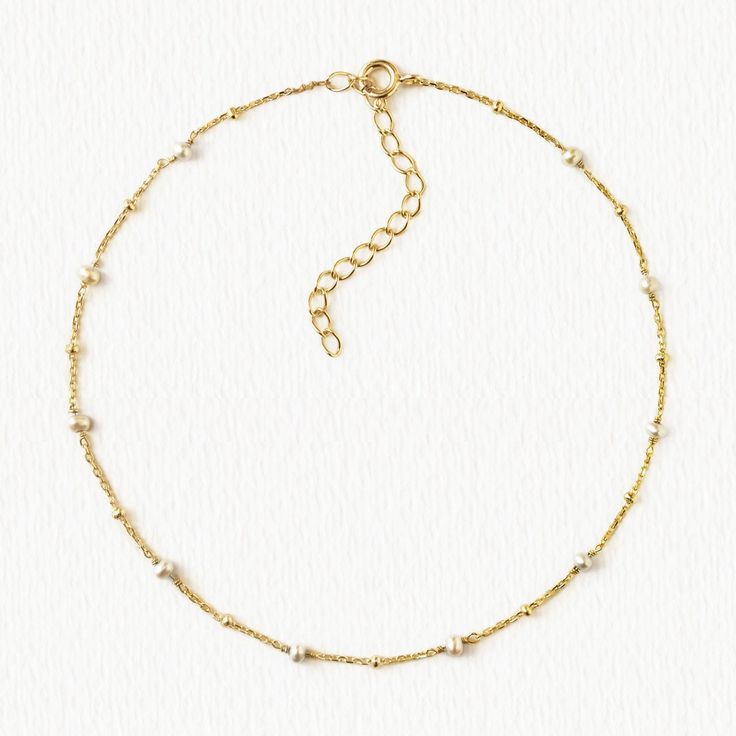 description For an elegant and classic look. This pearl anklet has the perfect combination of dainty and bohemian. end description materials Gold Vermeil Fresh Water Pearls Hypoallergenic, lead and nickel free end materials details Length 9in (20.3cm) Extension: 2in (5cm) Spring clasp closure end details sku #ANK085 end sku Delicate Pearl Chain Anklets, Elegant Pearl Chain Anklets For Wedding, Elegant Wedding Anklets With Pearl Chain, Elegant Wedding Pearl Chain Anklets, Elegant Adjustable Anklets With Pearl Charm, Elegant Adjustable Anklets With Delicate Chain, Elegant Adjustable Pearl Anklets, Elegant Adjustable Delicate Chain Anklet, Elegant Pearl Anklets With Pearl Chain