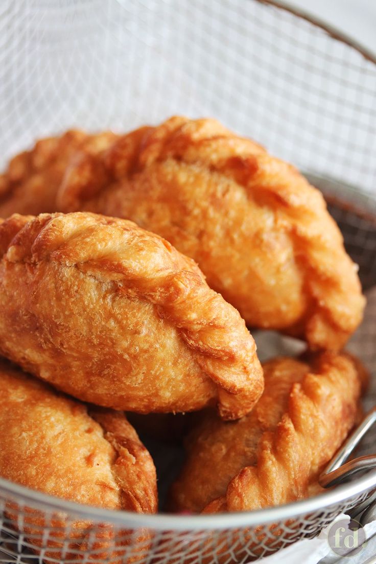 some fried food in a bowl with a spoon