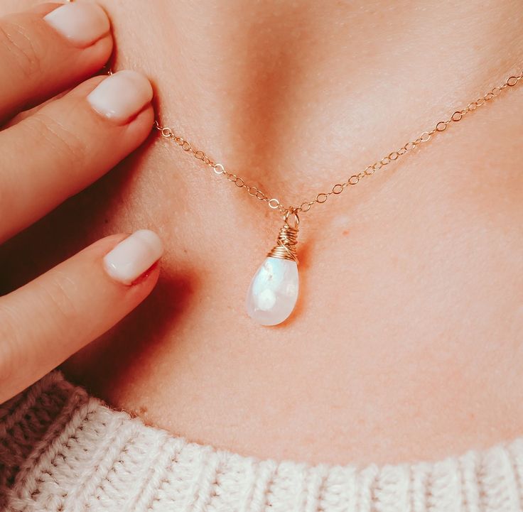 "This beautiful moonstone necklace is the official birthstone for the month of June. The 11-13mm Moonstone is set delicately on your choice of length chain in gold filled, sterling silver, or rose gold filled.  When searching for the perfect necklace you want to ensure that all ends are soldered for durability. Otherwise the necklace is prone to breaking easily because the links are not closed completely.  All of our necklaces are soldered for a durability and longevity.  Materials:  11-13mm moo Gold Moonstone Briolette Necklace, Gold Necklace With Moonstone Briolette, Gold Moonstone Necklace With Briolette Shape, Delicate Moonstone Crystal Necklace Gift, Delicate Moonstone Crystal Necklace As A Gift, Dainty Moonstone Charm Necklace For Gift, Dainty White May Birthstone Jewelry, Dainty Moonstone Birthstone Jewelry, Moonstone Briolette Necklace For Gift