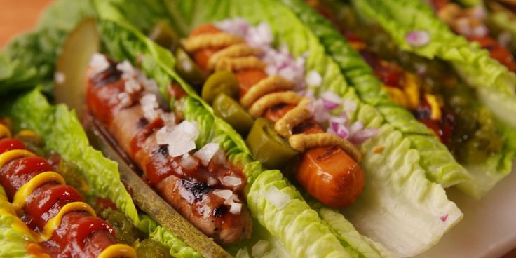 lettuce, carrots and other vegetables on a plate with skewers