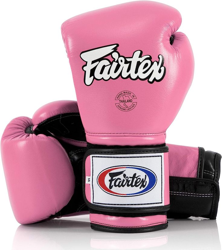 a pink boxing glove with the word fairtex on it's front and side