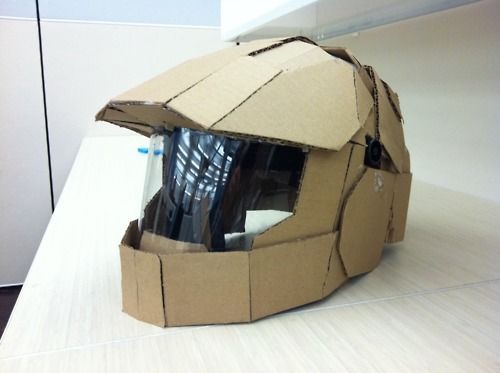 an open cardboard helmet sitting on top of a counter