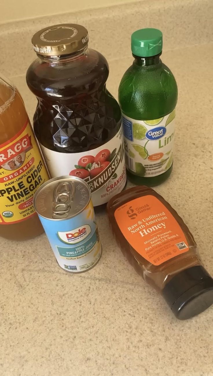 several different types of condiments sitting on a counter top next to each other