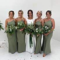 the bridesmaids are all dressed in green dresses