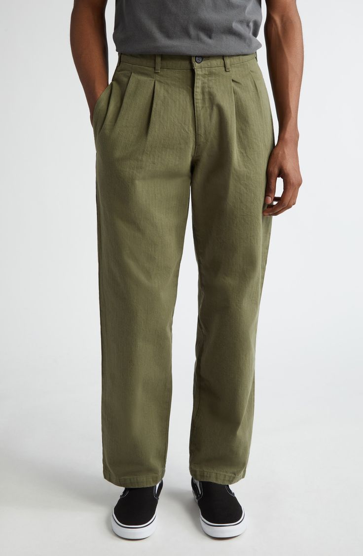 Japanese cotton in a herringbone weave adds to the premium comfort and lasting wear of these pleat-front pants that epitomize casual ease. 31 1/2" inseam; 17" leg opening; 11 1/2" front rise; 15 1/2" back rise (size 32) Zip fly with button closure Side-seam pockets; back button-welt pockets 100% cotton Machine wash, tumble dry Made in Portugal Designer Clothing Cotton Wide Leg Pants With Pleated Waist, Relaxed Fit Trousers With Pleated Waist, Casual Pleated Straight Leg Bottoms, Cotton Wide Leg Bottoms With Pleated Waist, Pleated Cotton Bottoms For Workwear, Relaxed Fit Bottoms With Pleated Waist, Business Casual Bottoms With Pleated Waist And Relaxed Fit, Casual Cotton Bottoms With Straight Hem, Cotton Bottoms With Straight Hem For Casual Gatherings